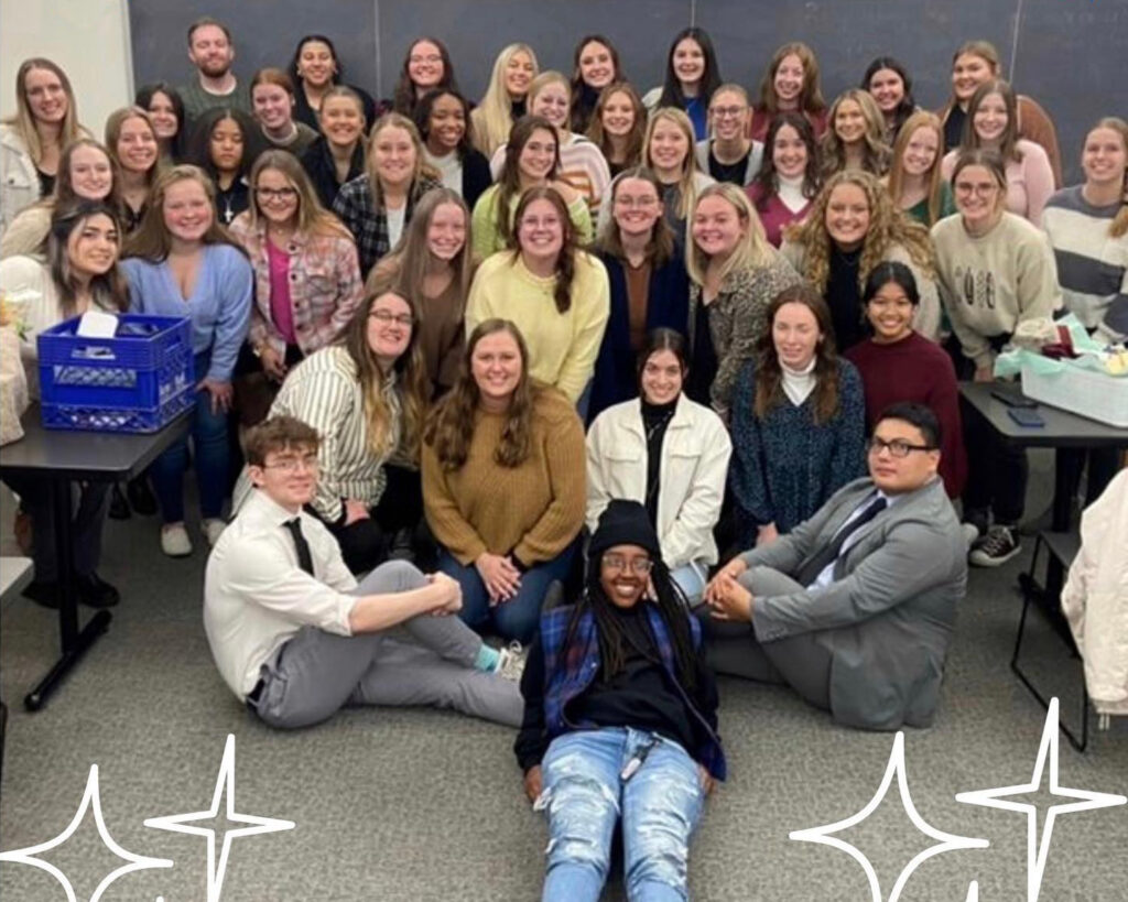 The Eta Sigma chapter of Alpha Phi Omega at Illinois College poses as a group following a ceremony in Spring 2023.